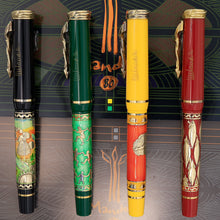 Load image into Gallery viewer, Side view of the green and black, green, yellow and orange, and red fountain pens with golden accents. 
