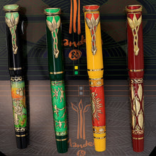 Load image into Gallery viewer, Front view of the green and black, green, yellow and orange, and red fountain pens with golden accents. 
