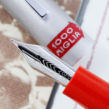 Load image into Gallery viewer, Close up to the fountain pen clip and the cap decoration with text: 1000 Miglia
