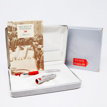 Load image into Gallery viewer, The fountain pen arranged with the booklet, presentation box, and outer box.
