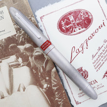 Load image into Gallery viewer, Front view of the fountain pen arranged with the included documents.
