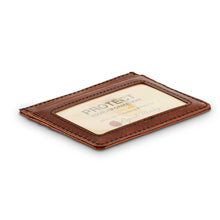 Load image into Gallery viewer, Angled view of the leather card stock. It features a windowed ID slot.

