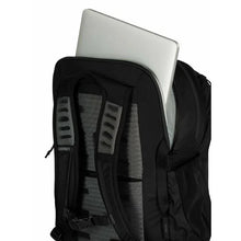 Load image into Gallery viewer, Angled back view of the backpack, with a laptop peeking from a padded compartment.

