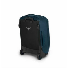 Load image into Gallery viewer, Angled back panel view of the blue suitcase. The back panel is black.
