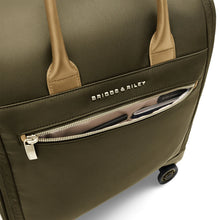 Load image into Gallery viewer, Briggs &amp; Riley Rhapsody Wheeled Cabin Bag - Shown in Olive

Image of Front Panel zippered pocket for quick access to your passport, ticket, etc.

Dimensions:  16 x 14 x 8.5 in / 40.6 x 35.6 x 21.6 cm (includes wheels and handle)
