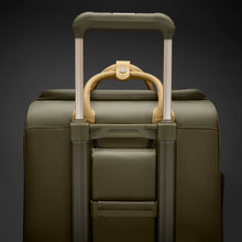 Load image into Gallery viewer, Briggs &amp; Riley Rhapsody Wheeled Cabin Bag - Shown in Olive

Image of Attachable Feature on back panel, allowing this wheeled cabin bag to ride along the telescoping handle of your carry-on trolley cabin bag

Dimensions:  16 x 14 x 8.5 in / 40.6 x 35.6 x 21.6 cm (includes wheels and handle)
