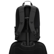 Load image into Gallery viewer, Back panel view of the black backpack with the attachment feature holding it to the extended handle of a suitcase
