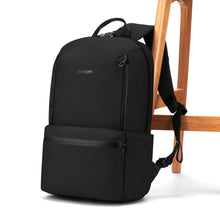 Load image into Gallery viewer, Black backpack on a white background, leaning on a wooden chair.
