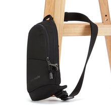 Load image into Gallery viewer, The sling bag with the shoulder strap attached to a chair.

