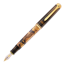 Load image into Gallery viewer, Uncapped fountain pen with cloud design on a white background.
