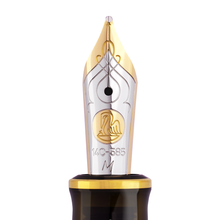 Load image into Gallery viewer, Fountain pen nib with gold and silver design on a white background.
