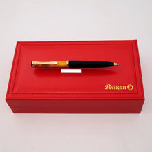 Load image into Gallery viewer, Pelikan pen on top of the presentation box on a white background

