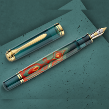 Load image into Gallery viewer, Side view of the fountain pen with the cap next to it.
