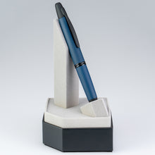 Load image into Gallery viewer, Angled front view of the pen placed in its stand.
