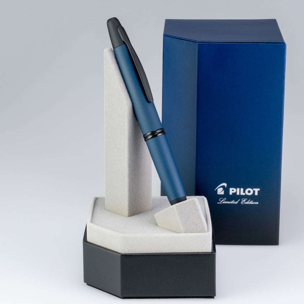 The pen placed on its stand with the packaging in the background.