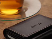 Load image into Gallery viewer, Close up to the pularys engraving on the Boston brown leather wallet. 
