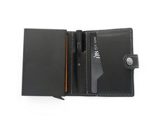 Load image into Gallery viewer, Interior view of the black wallet with a pen tucked in the middle compartment. 
