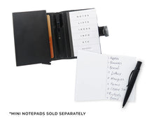 Load image into Gallery viewer, Interior view of the black wallet with a compact notepad tucked inside, with text: Sold separately.

