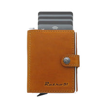Load image into Gallery viewer, Front panel view of the cognac leather wallet with Retro 51 embossing. Six cards peek above from the lever case.
