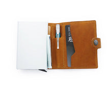 Load image into Gallery viewer, Interior view of the cognac wallet with a pen, bill, and credit card. 

