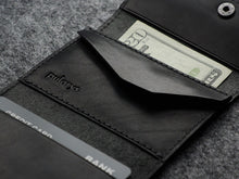 Load image into Gallery viewer, Close up to the wallet's change pocket with Pularys logo embossing. 

