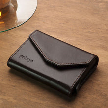 Load image into Gallery viewer, Angled view o the brown wallet with Pularys engraving. 
