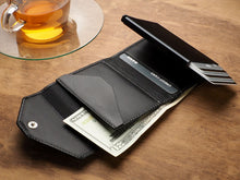 Load image into Gallery viewer, Interior view of the black wallet with credit cards
