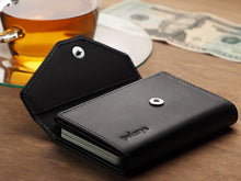 Load image into Gallery viewer, Angled view of the black wallet with the snap button flap lifted.
