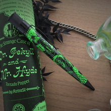 Load image into Gallery viewer, Side view of the pen leaning on the matching gift tube. 
