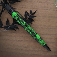 Load image into Gallery viewer, Side view of the pen on a wood-textured background.
