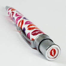 Load image into Gallery viewer, Angled top view of the pen on a light gray background. The top disk has a red lip mark. 
