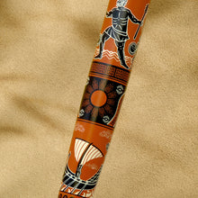 Load image into Gallery viewer, Close-up of the rollerball pen depicting a sun on a beige textured surface.
