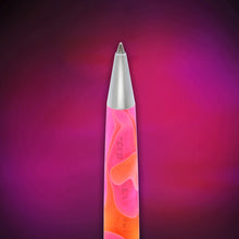 Load image into Gallery viewer, A close up of the tip of the pink and orange acrylic pen, centered against a dark purple and magenta gradient background.
