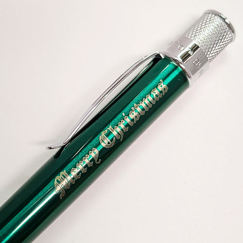 Green pen with Merry Christmas engraving.
