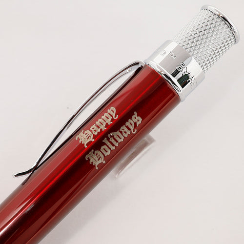 Retro 51 Red Classic Lacquer pen with chrome accents and happy holidays engraving on a light background.