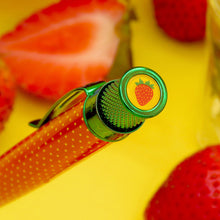Load image into Gallery viewer, Angled close up to the top of the pen. An illustration of a strawberry on a yellow background decorates the disk.
