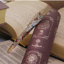Load image into Gallery viewer, Pen with Stained-glass design on an open book.
