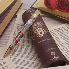Load image into Gallery viewer, Pen with Stained-glass design on an open book.
