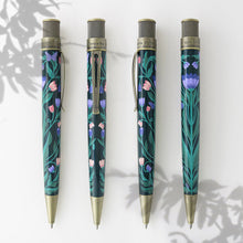 Load image into Gallery viewer, Front, back, and side views of the Growth pen on a white background with wild flower silhouettes. 
