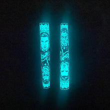 Load image into Gallery viewer, Front and back views of the Picture of Dorian Gray pen glowing in the dark.
