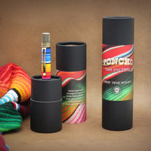 Load image into Gallery viewer, The sarape style rollerball pen displayed in its black packing tube.
