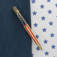 Load image into Gallery viewer, Front view of the rollerball pen. Placed on a textured blue background split by a white background with stars.

