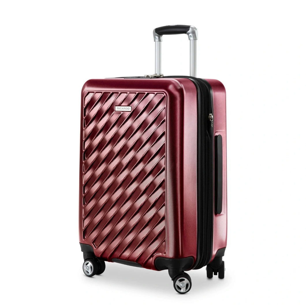 Angled front panel view of the red hard shell suitcase. 