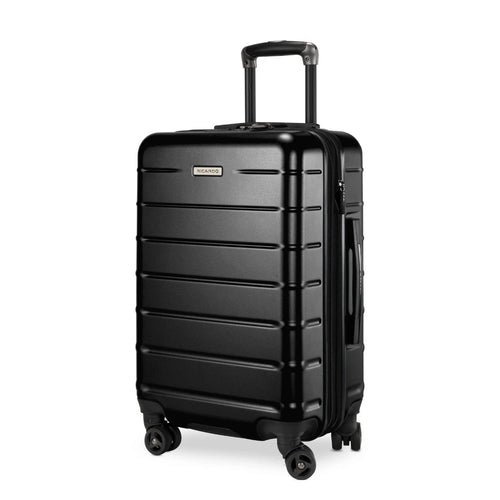 Angled front panel view of the black hard shell suitcase. 