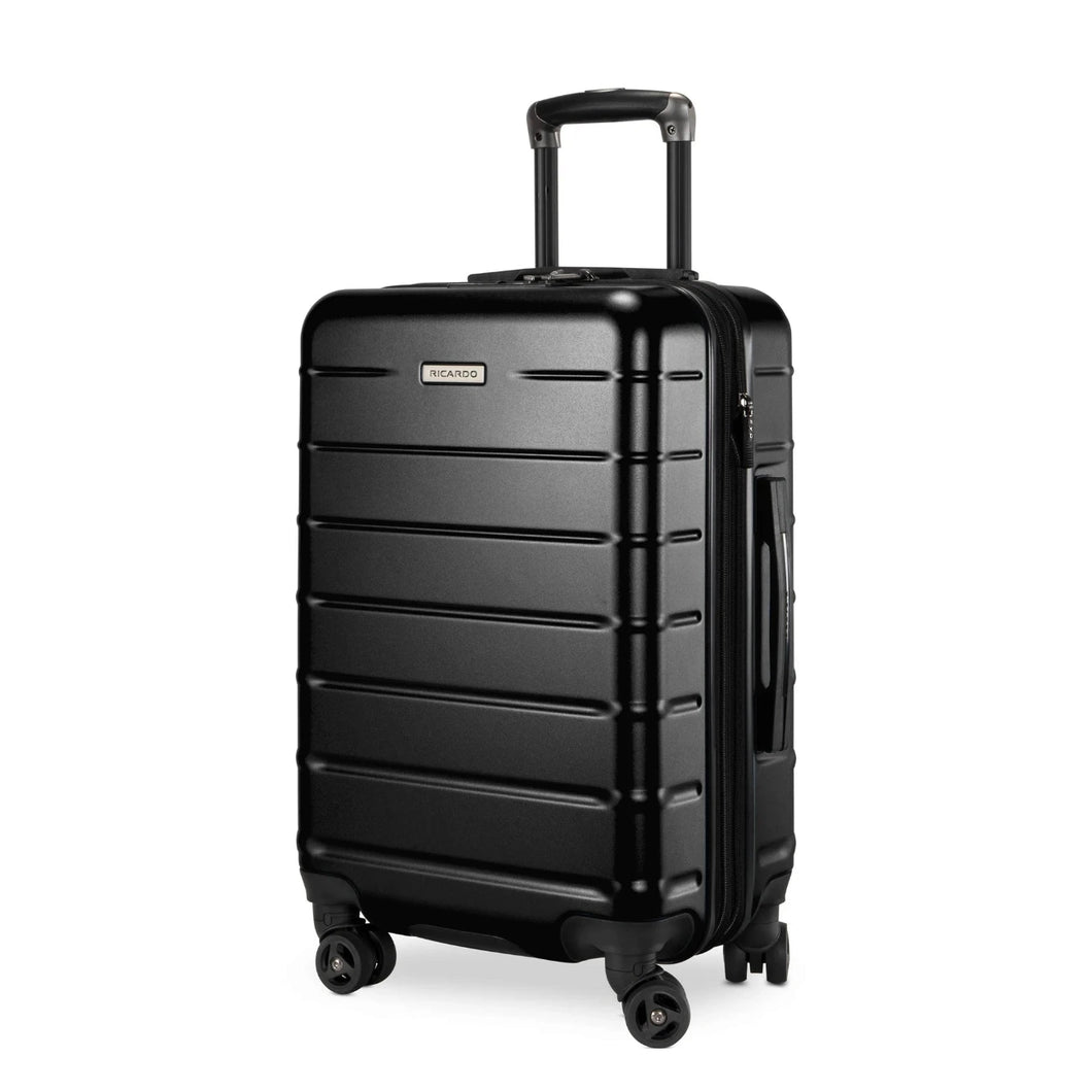 Angled front panel view of the black hard shell suitcase. 