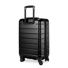 Load image into Gallery viewer, Angled back panel view of the back hard shell suitcase. 
