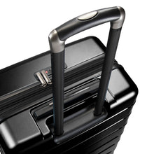 Load image into Gallery viewer, Angled top panel view of the black hard shell suitcase with the handle extended. 
