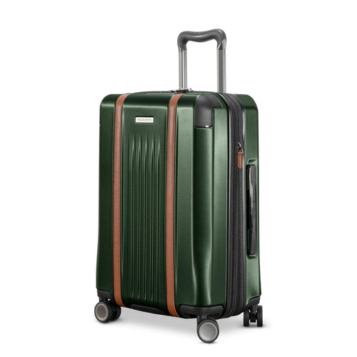 Angled front panel view of the green hard shell suitcase. 