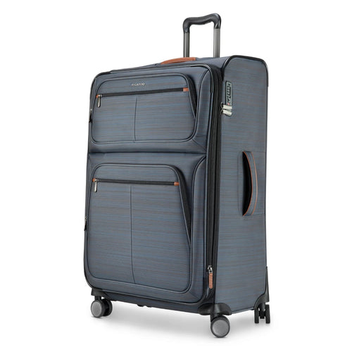 Angled front panel view of a gray soft sided suitcase. 