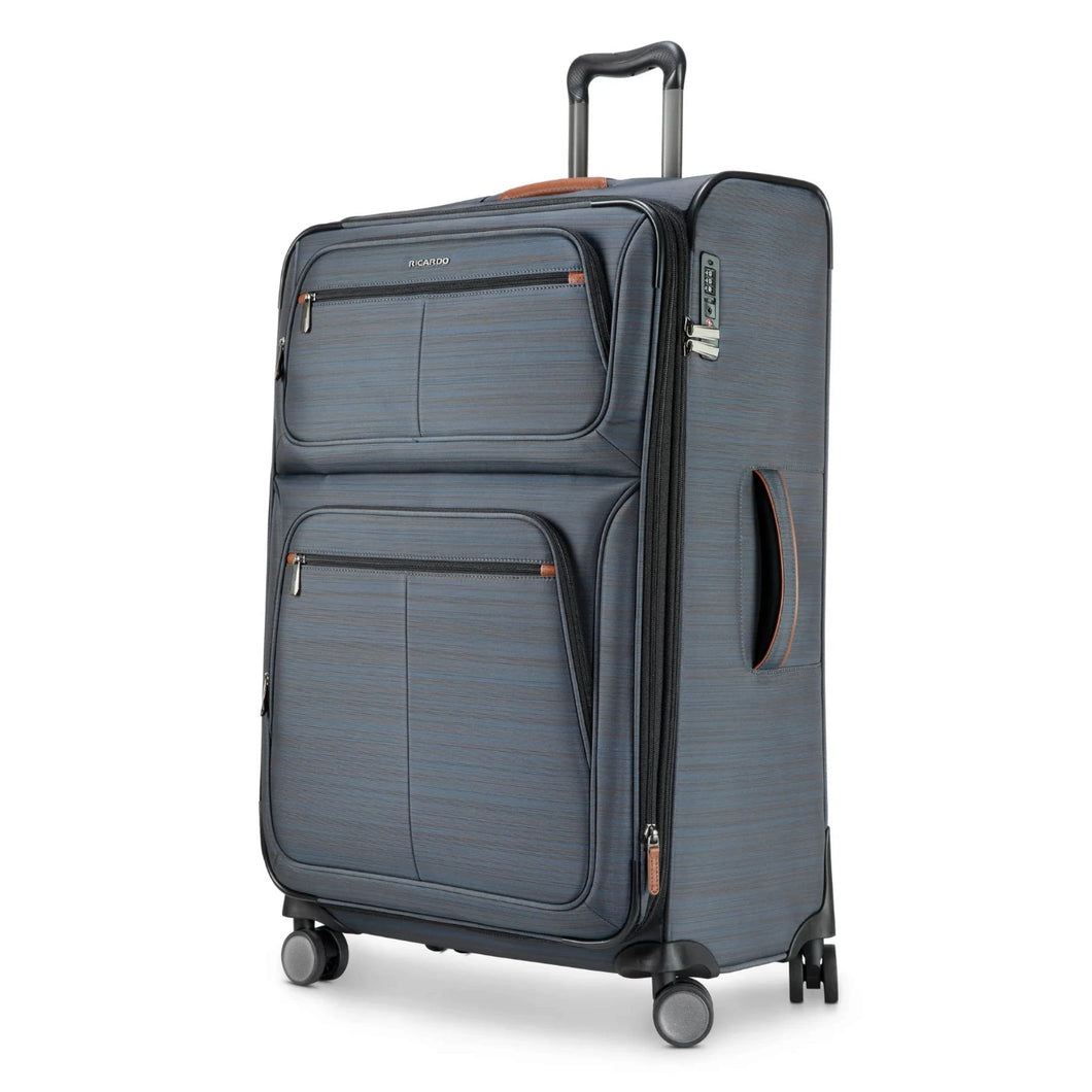 Angled front panel view of a gray soft sided suitcase. 
